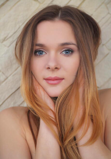 Slender young Karissa Diamond revealing tiny tits and shaved pussy 